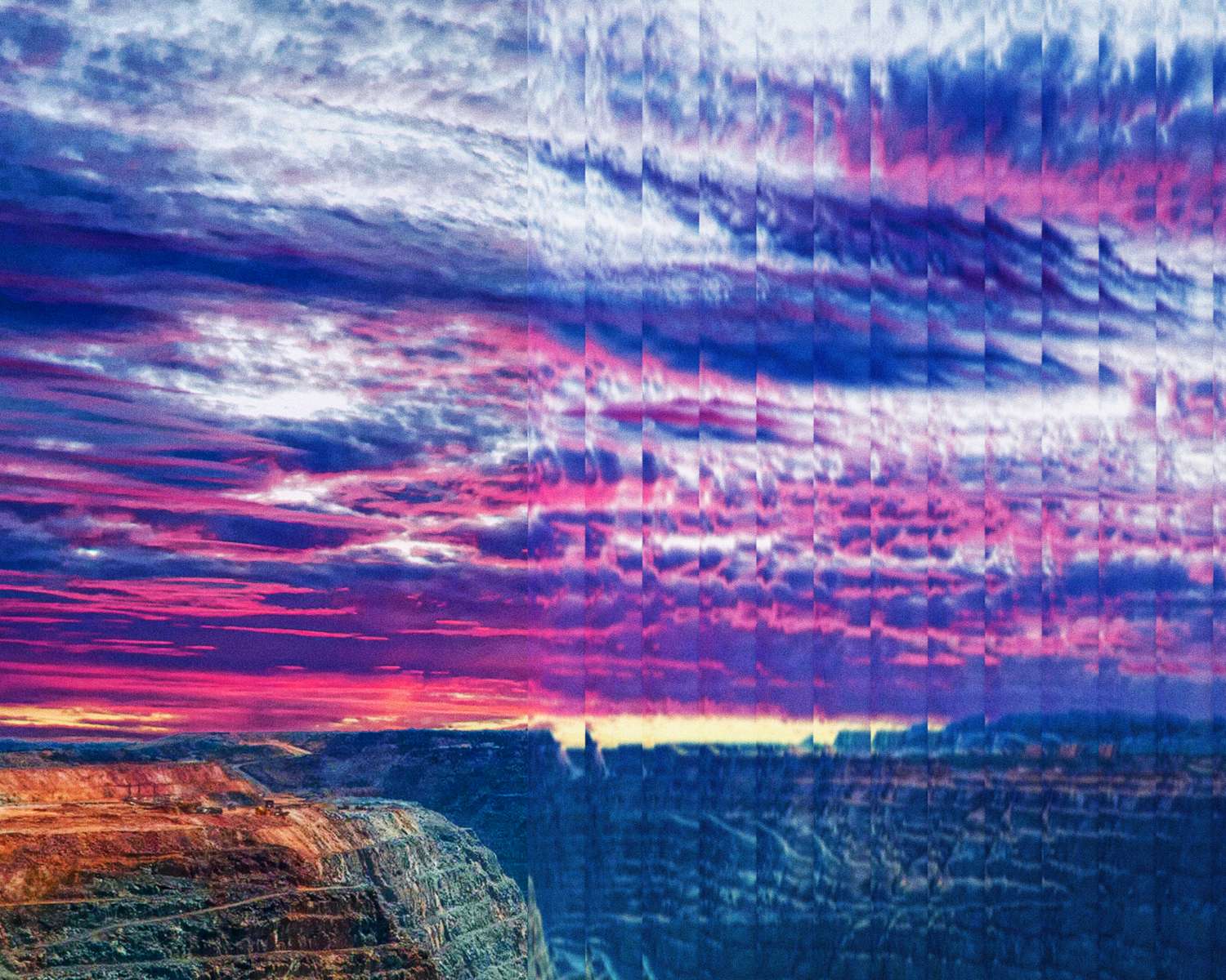 Striated dusk sky over an open-pit mine, from the cover of the report